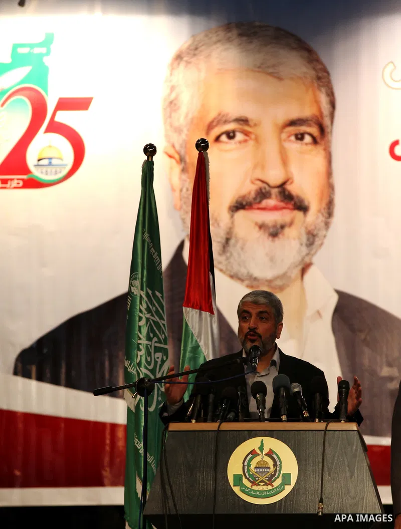 Hamas chief Khaled Meshaal attends a ceremony with Greek Orthodox Archbishop Alexios and senior Muslim cleric Hassan Al-Jojo in Gaza City December 9, 2012. Meshaal, in a defiant speech during his first ever visit to Gaza...