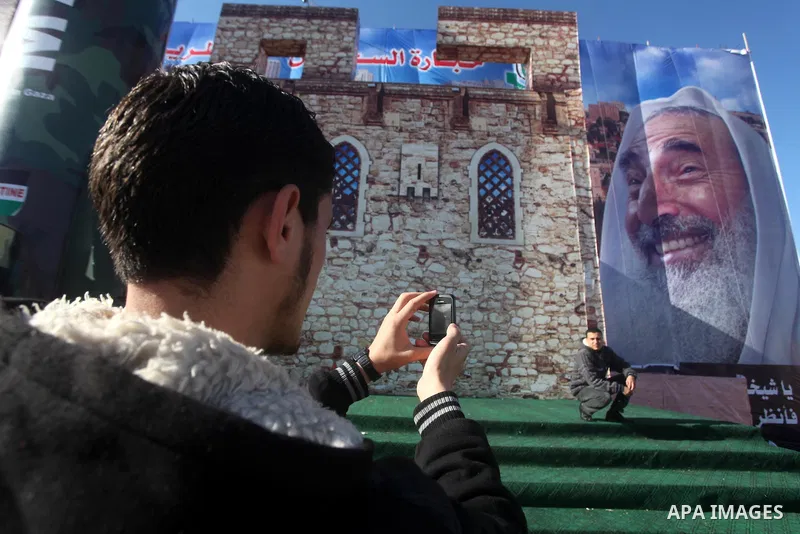Palestinians take pictures in front of a gigantic model of a locally made M75 rocket in Gaza city, December 10, 2012. Hamas chief Khaled Meshaal arrived on December 7 during his first-ever visit to the Gaza Strip amid ti...