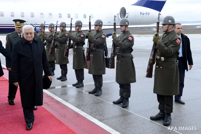 Palestinian President Mahmoud Abbas reviews honor guards upon his arrival to Ankara during an official visit to Turkey on December 10, 2012. Photo by Thaer Ganaim