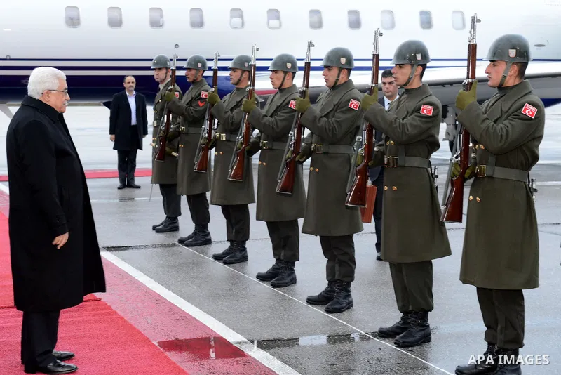 Palestinian President Mahmoud Abbas reviews honor guards upon his arrival to Ankara during an official visit to Turkey on December 10, 2012. Photo by Thaer Ganaim
