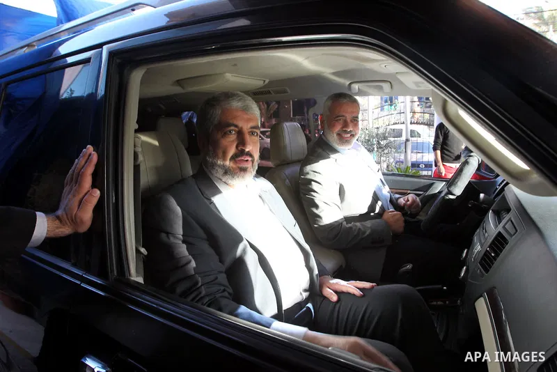 Hamas leader in exile Khaled Meshaal and Palestinian Prime Minister in the Gaza Strip Ismail Haniya ride their car to the Rafah crossing border, upon Meshaal departure from the Gaza Strip on December 10, 2012 in Gaza. Ex...