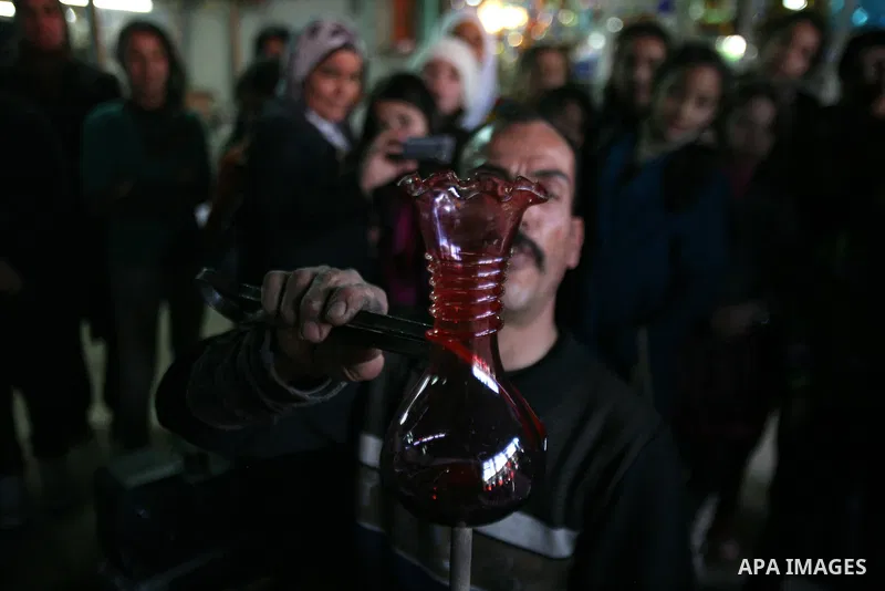 A Palestinian worker makes a different types of glasses in AL-SALAM factory in the West Bank city of Hebron December 12, 2012. Glass has been a traditional industry in Hebron for over 600 years but as a result of the inc...