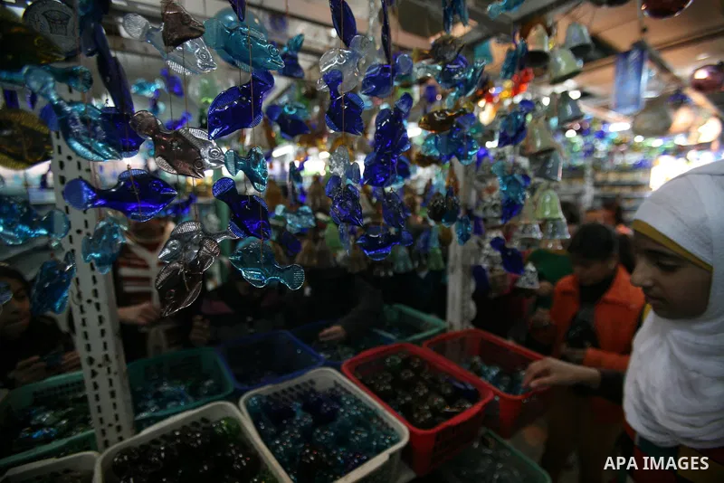 Palestinians buy a different types of glasses in AL-SALAM factory in the West Bank city of Hebron December 12, 2012. Glass has been a traditional industry in Hebron for over 600 years but as a result of the increased vio...