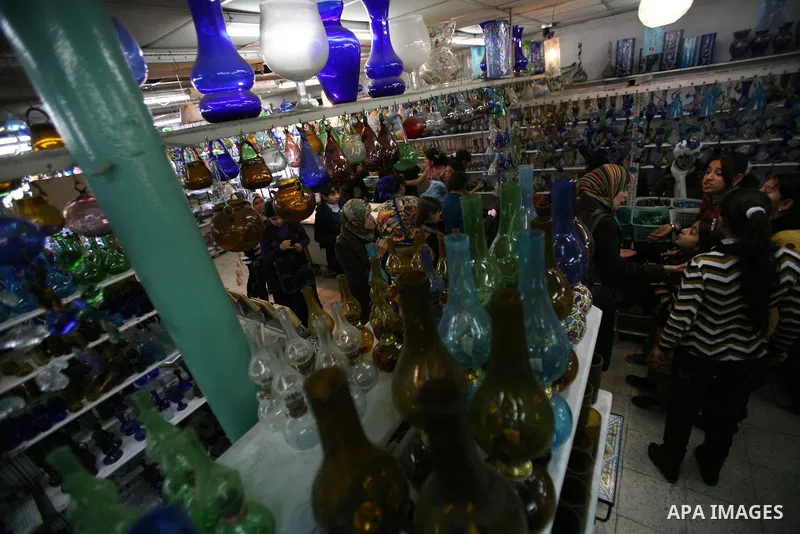 Palestinians buy a different types of glasses in AL-SALAM factory in the West Bank city of Hebron December 12, 2012. Glass has been a traditional industry in Hebron for over 600 years but as a result of the increased vio...