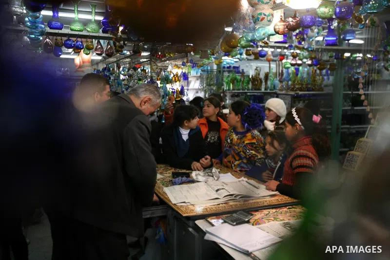 Palestinians buy a different types of glasses in AL-SALAM factory in the West Bank city of Hebron December 12, 2012. Glass has been a traditional industry in Hebron for over 600 years but as a result of the increased vio...