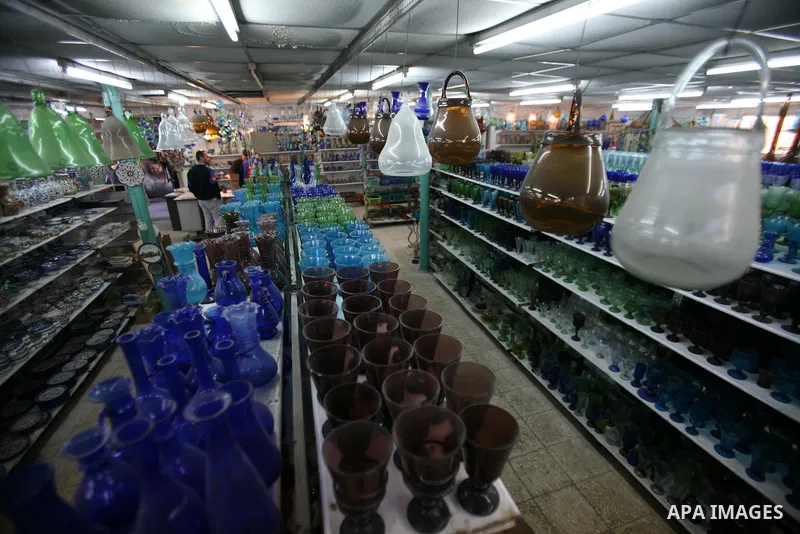 Palestinians buy a different types of glasses in AL-SALAM factory in the West Bank city of Hebron December 12, 2012. Glass has been a traditional industry in Hebron for over 600 years but as a result of the increased vio...