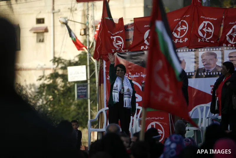 PFLP's Leila Khaled takes part in a rally organized by the Popular Front for the Liberation of Palestine (PFLP) to mark the 45th anniversary of the founding of the PFLP in Khan Younis southern Gaza strip, December 12, 20...