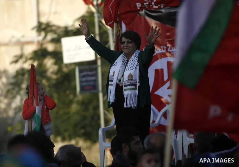 PFLP's Leila Khaled takes part in a rally organized by the Popular Front for the Liberation of Palestine (PFLP) to mark the 45th anniversary of the founding of the PFLP in Khan Younis southern Gaza strip, December 12, 20...