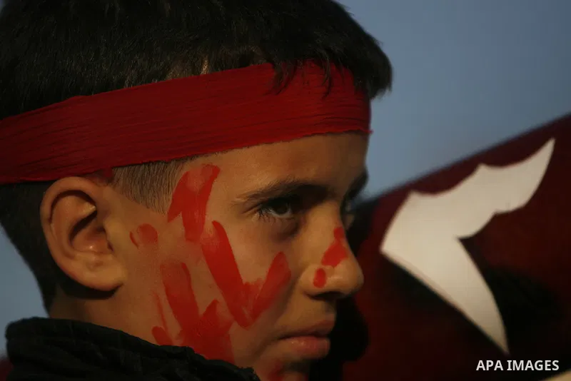 Supporters of the Popular Front for the Liberation of Palestine (PFLP) carry the party flag during a rally to mark the 45th anniversary of the founding of the PFLP in Khan Younis southern Gaza strip, December 12, 2012. P...