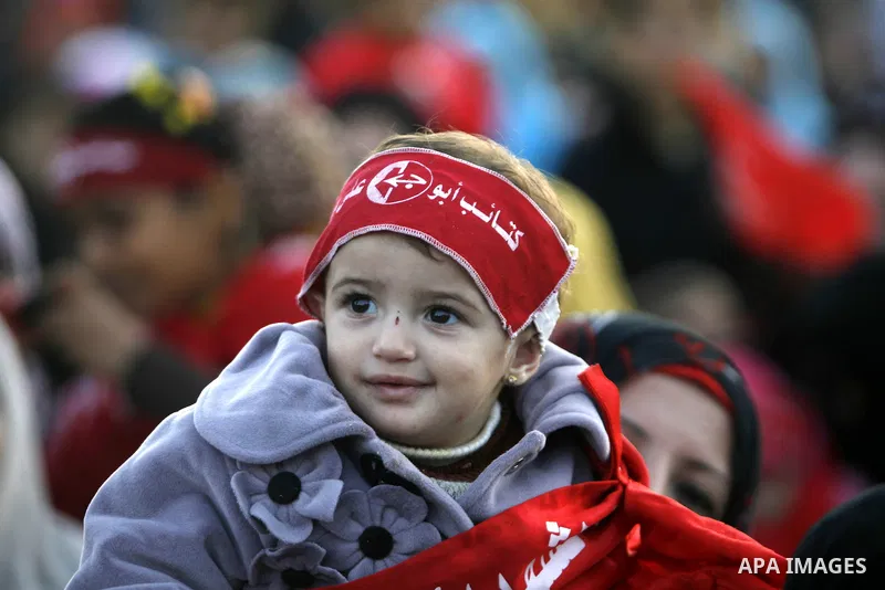 Supporters of the Popular Front for the Liberation of Palestine (PFLP) carry the party flag during a rally to mark the 45th anniversary of the founding of the PFLP in Khan Younis southern Gaza strip, December 12, 2012. P...