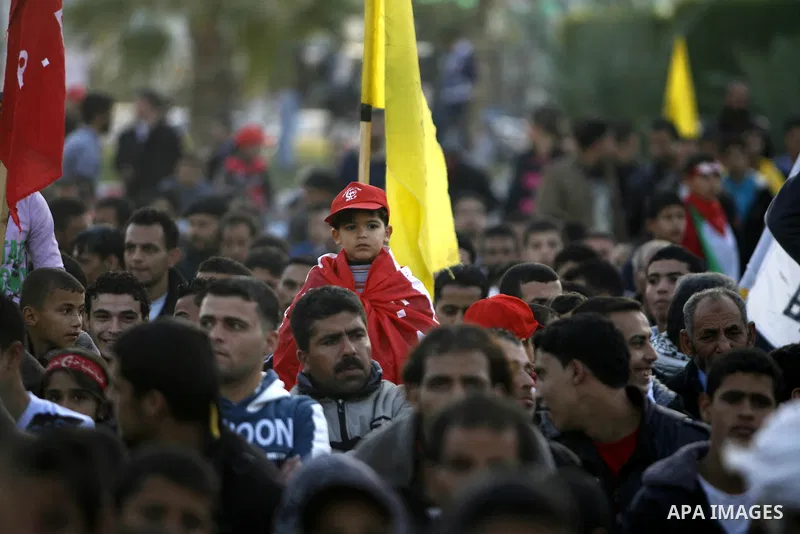 Supporters of the Popular Front for the Liberation of Palestine (PFLP) carry the party flag during a rally to mark the 45th anniversary of the founding of the PFLP in Khan Younis southern Gaza strip, December 12, 2012. P...