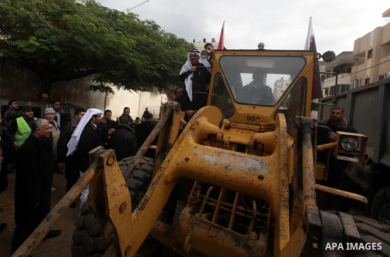 Palestinian Prime Minister Ismail Haniyeh and Qatari ambassador Mohammed al-Imadi visit bombed area during the launching ceremony of Qatari grant projects in Gaza city on 13 Dec, 2012. The emir of Qatar Sheikh Hamad bin...