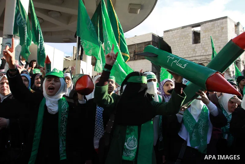 Palestinian Hamas supporters attend a Hamas rally marking the 25th anniversary of the Islamist movement's founding in the West Bank city of Nablus on December 13, 2012. Rapprochement between rival Palestinian factions Ha...