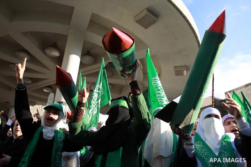 Palestinian Hamas supporters attend a Hamas rally marking the 25th anniversary of the Islamist movement's founding in the West Bank city of Nablus on December 13, 2012. Rapprochement between rival Palestinian factions Ha...