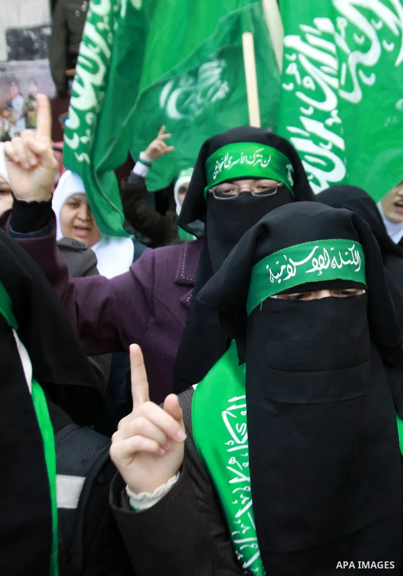 Palestinian Hamas supporters attend a Hamas rally marking the 25th anniversary of the Islamist movement's founding in the West Bank city of Nablus on December 13, 2012. Rapprochement between rival Palestinian factions Ha...