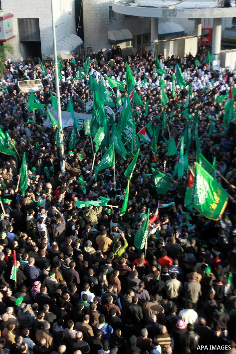 Palestinian Hamas supporters attend a Hamas rally marking the 25th anniversary of the Islamist movement's founding in the West Bank city of Nablus on December 13, 2012. Rapprochement between rival Palestinian factions Ha...