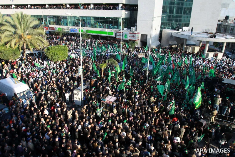 Palestinian Hamas supporters attend a Hamas rally marking the 25th anniversary of the Islamist movement's founding in the West Bank city of Nablus on December 13, 2012. Rapprochement between rival Palestinian factions Ha...