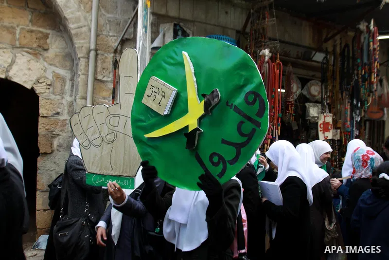 Palestinian Hamas supporters attend a Hamas rally marking the 25th anniversary of the Islamist movement's founding in the West Bank city of Nablus on December 13, 2012. Rapprochement between rival Palestinian factions Ha...
