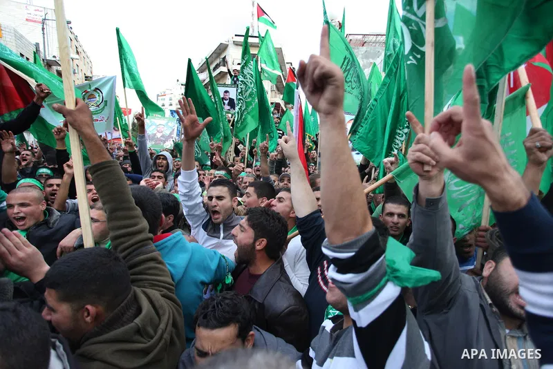Palestinian supporters of Hamas attend a rally marking the 25th anniversary of the Islamist movement's foundation in the West bank city of Ramallah, 14 December 2012. Hamas held its first rally in the West Bank on 13 Dec...