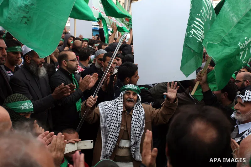 Palestinian supporters of Hamas attend a rally marking the 25th anniversary of the Islamist movement's foundation in the West bank city of Ramallah, 14 December 2012. Hamas held its first rally in the West Bank on 13 Dec...