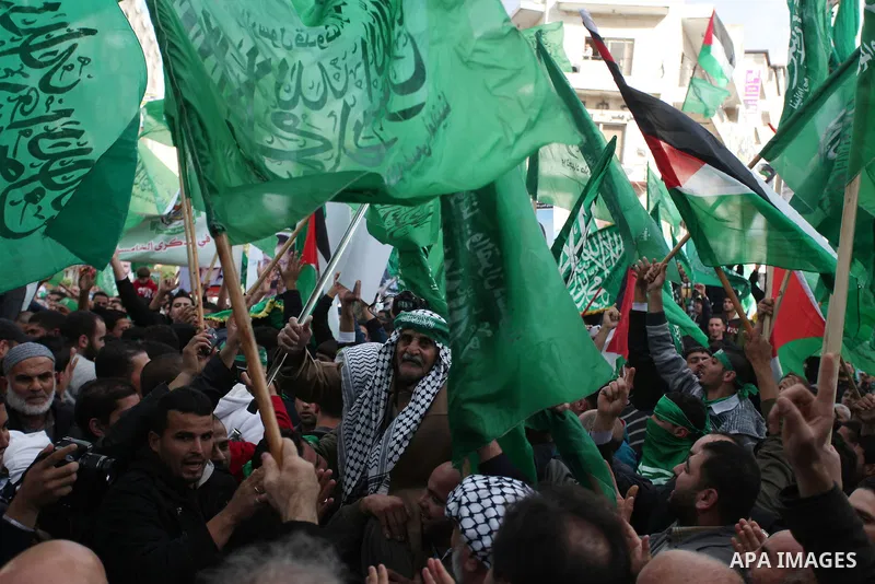 Palestinian supporters of Hamas attend a rally marking the 25th anniversary of the Islamist movement's foundation in the West bank city of Ramallah, 14 December 2012. Hamas held its first rally in the West Bank on 13 Dec...