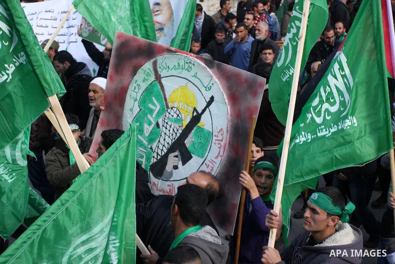 Palestinian supporters of Hamas attend a rally marking the 25th anniversary of the Islamist movement's foundation in the West bank city of Ramallah, 14 December 2012. Hamas held its first rally in the West Bank on 13 Dec...
