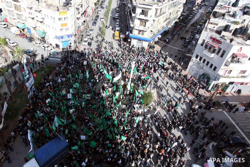 Palestinian supporters of Hamas attend a rally marking the 25th anniversary of the Islamist movement's foundation in the West bank city of Ramallah, 14 December 2012. Hamas held its first rally in the West Bank on 13 Dec...