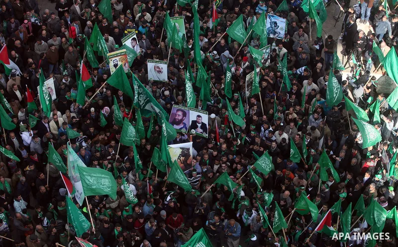Palestinian supporters of Hamas attend a rally marking the 25th anniversary of the Islamist movement's foundation in the West bank city of Ramallah, 14 December 2012. Hamas held its first rally in the West Bank on 13 Dec...