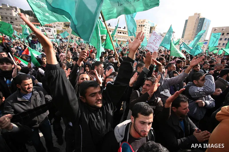 Hamas supporters take part in a rally celebrating the 25th anniversary of the founding of the Islamist mouvement, on December 14, 2012, in the West Bank city of Hebron. The rally is the first time that the West Bank's ru...