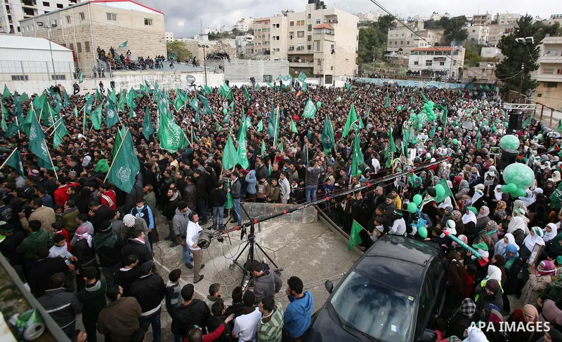 Hamas supporters take part in a rally celebrating the 25th anniversary of the founding of the Islamist mouvement, on December 14, 2012, in the West Bank city of Hebron. The rally is the first time that the West Bank's ru...