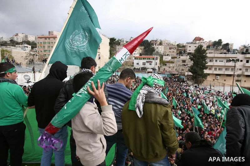Hamas supporters take part in a rally celebrating the 25th anniversary of the founding of the Islamist mouvement, on December 14, 2012, in the West Bank city of Hebron. The rally is the first time that the West Bank's ru...