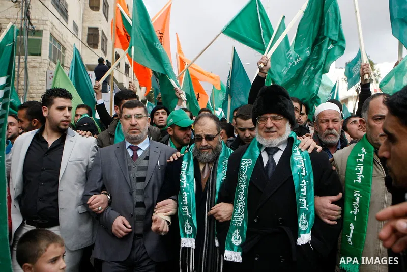 Hamas supporters take part in a rally celebrating the 25th anniversary of the founding of the Islamist mouvement, on December 14, 2012, in the West Bank city of Hebron. The rally is the first time that the West Bank's ru...