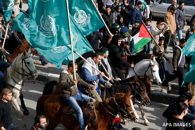 Hamas supporters take part in a rally celebrating the 25th anniversary of the founding of the Islamist mouvement, on December 14, 2012, in the West Bank city of Hebron. The rally is the first time that the West Bank's ru...