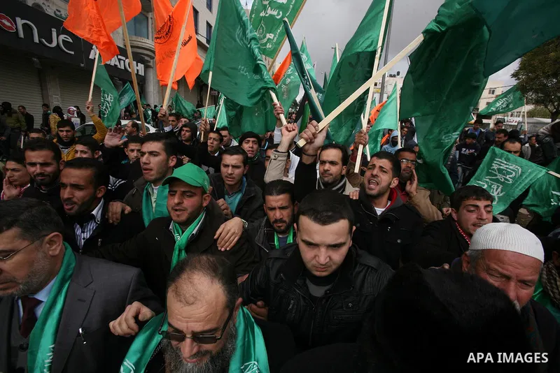 Hamas supporters take part in a rally celebrating the 25th anniversary of the founding of the Islamist mouvement, on December 14, 2012, in the West Bank city of Hebron. The rally is the first time that the West Bank's ru...