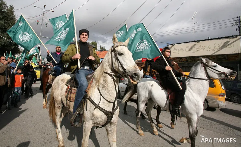 Hamas supporters take part in a rally celebrating the 25th anniversary of the founding of the Islamist mouvement, on December 14, 2012, in the West Bank city of Hebron. The rally is the first time that the West Bank's ru...