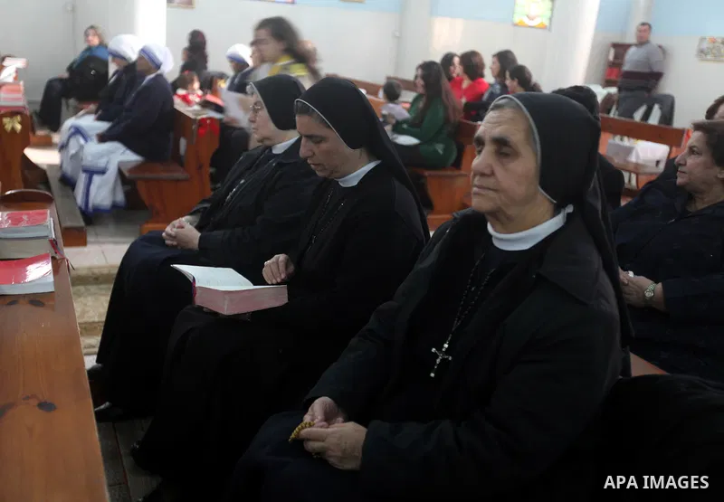 Palestinian Christians attend a prayers at the Latin Catholic Church in Gaza City, Sunday, Dec. 16, 2012. Twal arrived in Gaza on Sunday to attend a celebration with Palestinians ahead of Christmas. Photo by Majdi Fathi