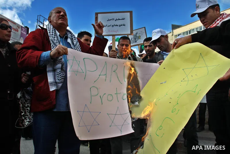 Palestinians demonstrate against the Paris Protocol and the Oslo Agreement, both key accords which govern economic ties between Palestinians and Israelis, and ask for the boycott of Israeli products in Nablus in the occu...