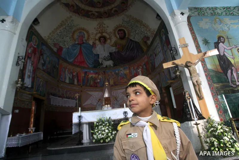 Palestinians celebrate during visiting Latin Patriarch of Jerusalem Fouad Twal in Gaza City, Sunday, Dec. 16, 2012. Twal arrived in Gaza on Sunday to attend a celebration with Palestinians ahead of Christmas. Photo by As...