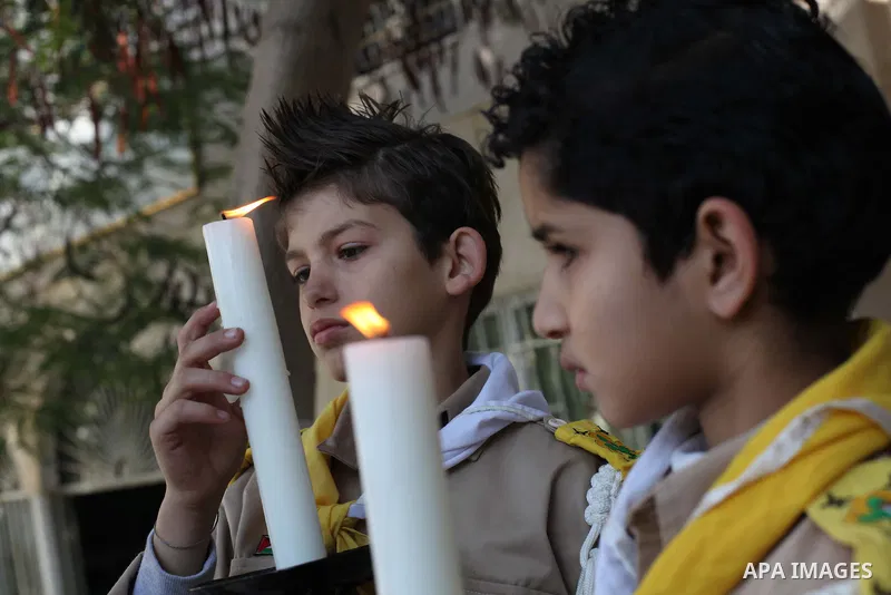 Palestinians celebrate during visiting Latin Patriarch of Jerusalem Fouad Twal in Gaza City, Sunday, Dec. 16, 2012. Twal arrived in Gaza on Sunday to attend a celebration with Palestinians ahead of Christmas. Photo by As...
