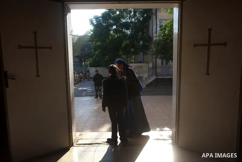 Palestinians celebrate during visiting Latin Patriarch of Jerusalem Fouad Twal in Gaza City, Sunday, Dec. 16, 2012. Twal arrived in Gaza on Sunday to attend a celebration with Palestinians ahead of Christmas. Photo by As...