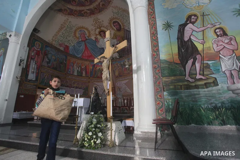 Palestinians celebrate during visiting Latin Patriarch of Jerusalem Fouad Twal in Gaza City, Sunday, Dec. 16, 2012. Twal arrived in Gaza on Sunday to attend a celebration with Palestinians ahead of Christmas. Photo by As...