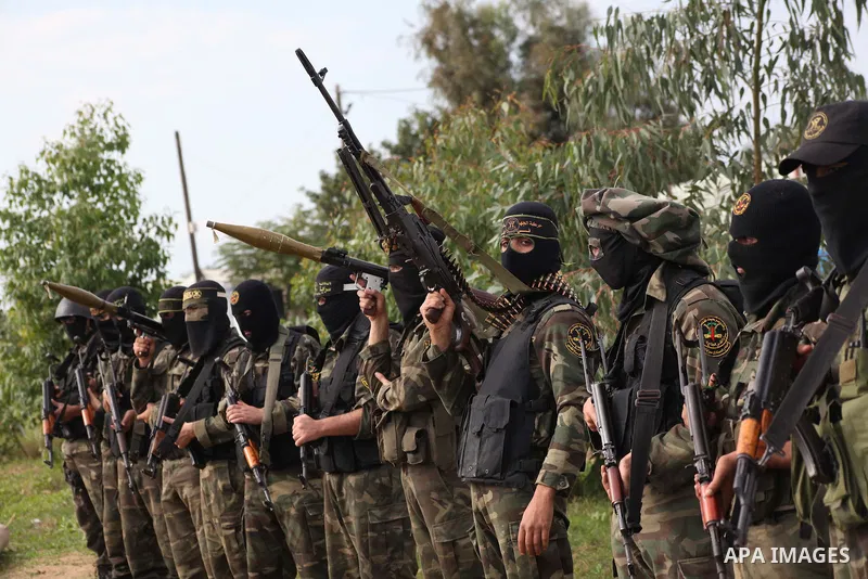 Palestinian militants from al-Quds Brigades the armed wing of the Islamic Jihad organization, stand during military exercises at an undisclosed location in the Hamas-run Gaza Strip in Gaza city on Dec 16. 2012. Hamas' ar...