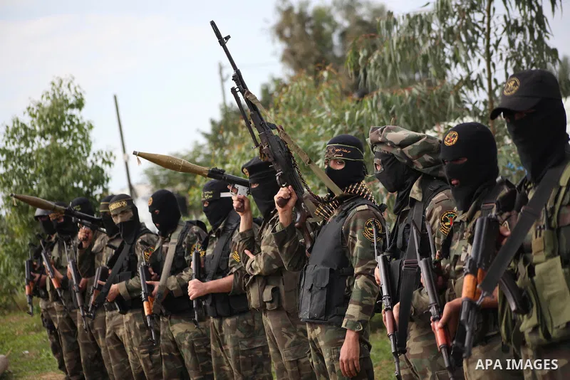 Palestinian militants from al-Quds Brigades the armed wing of the Islamic Jihad organization, stand during military exercises at an undisclosed location in the Hamas-run Gaza Strip in Gaza city on Dec 16. 2012. Hamas' ar...