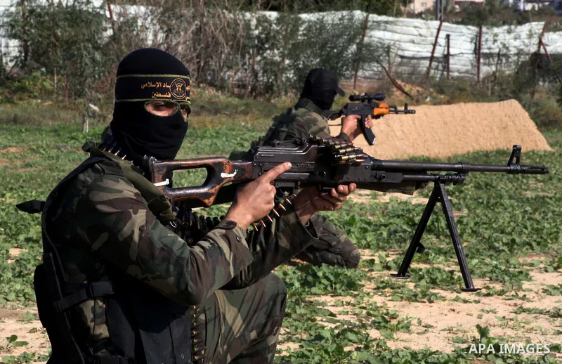 Palestinian militants from al-Quds Brigades the armed wing of the Islamic Jihad organization, sit during military exercises at an undisclosed location in the Hamas-run Gaza Strip in Gaza city on Dec 16. 2012. Hamas' arme...