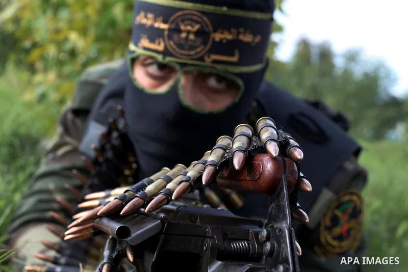 A Palestinian militant from al-Quds Brigades the armed wing of the Islamic Jihad organization, sits during military exercises at an undisclosed location in the Hamas-run Gaza Strip in Gaza city on Dec 16. 2012. Hamas' ar...