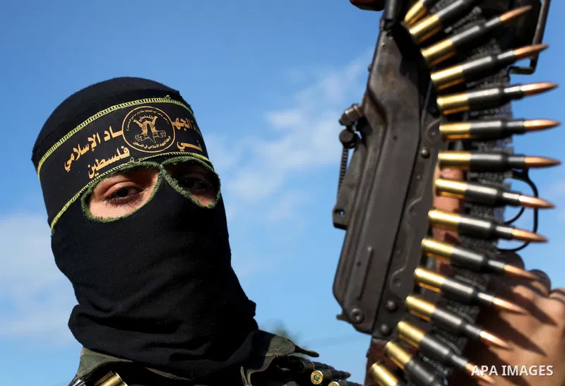A Palestinian militant from al-Quds Brigades the armed wing of the Islamic Jihad organization, stands during military exercises at an undisclosed location in the Hamas-run Gaza Strip in Gaza city on Dec 16. 2012. Hamas'...