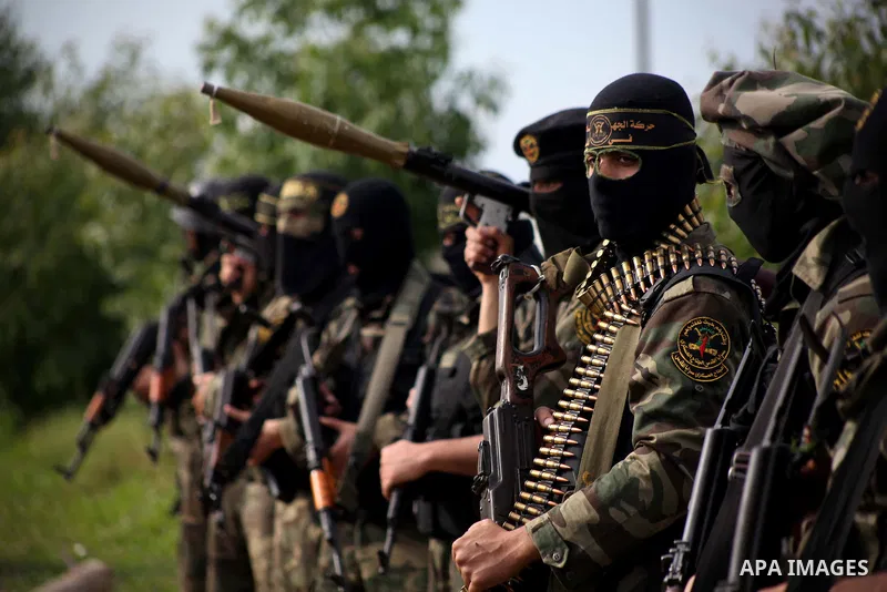 Palestinian militants from al-Quds Brigades the armed wing of the Islamic Jihad organization, stand during military exercises at an undisclosed location in the Hamas-run Gaza Strip in Gaza city on Dec 16. 2012. Hamas' ar...