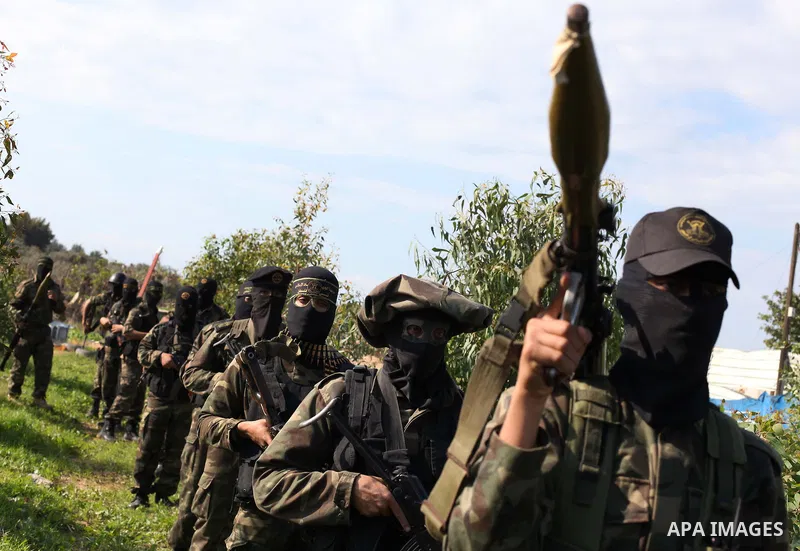 Palestinian militants from al-Quds Brigades the armed wing of the Islamic Jihad organization, stand during military exercises at an undisclosed location in the Hamas-run Gaza Strip in Gaza city on Dec 16. 2012. Hamas' ar...