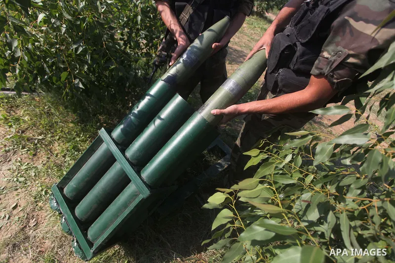 Palestinian militants from al-Quds Brigades the armed wing of the Islamic Jihad organization, stand around a rocket launcher during military exercises at an undisclosed location in the Hamas-run Gaza Strip in Gaza city o...