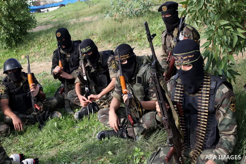Palestinian militants from al-Quds Brigades the armed wing of the Islamic Jihad organization, sit during military exercises at an undisclosed location in the Hamas-run Gaza Strip in Gaza city on Dec 16. 2012. Hamas' arme...